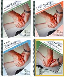 Learn Reiki 4 textbooks laid out