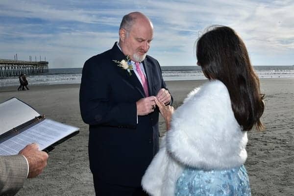 wedmates in winter with fur stole on bride