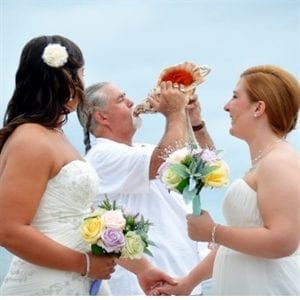 photos, photography, blowing shell horn, beach wedding, gay aloha